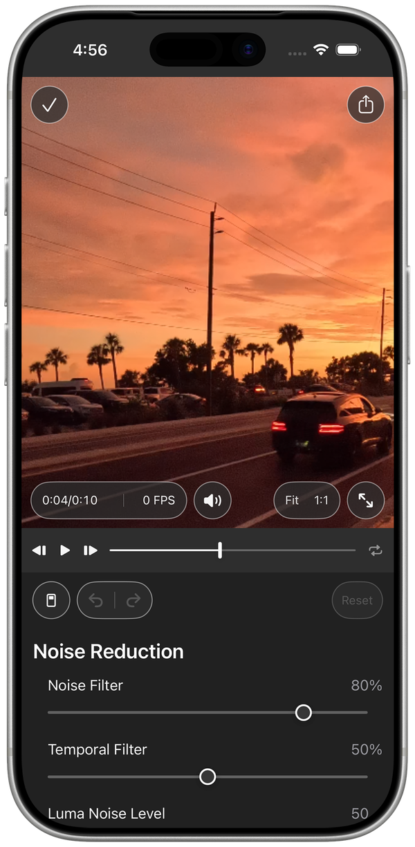 Noiseware on iPhone: a video open in the editor with the Noise Reduction sliders below it
